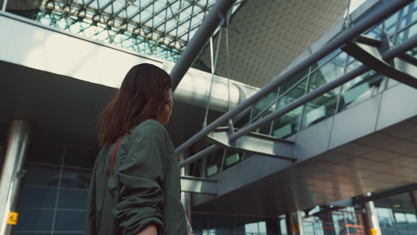 Young girl at the airport in the summer
