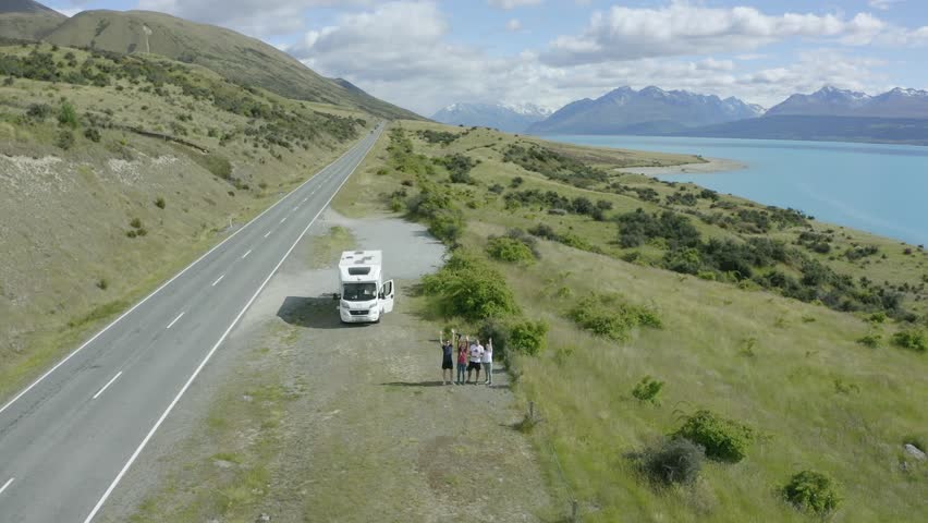 
Family filming theirselves with a drone, Lake Pukaki, New Zealand