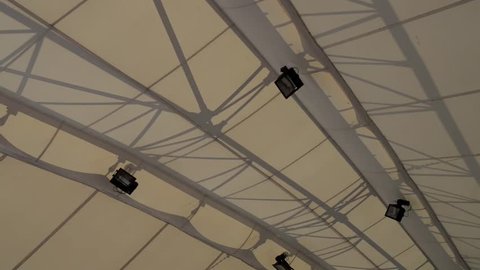 white fabric roof over the street stadium in the city center