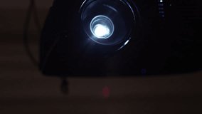 Projector light shining and making unique lens flare color - extreme close up