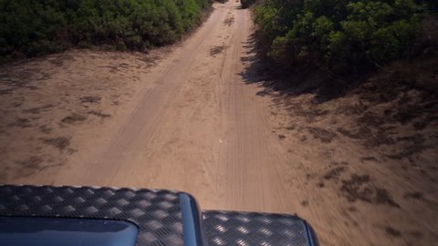POV shot from a camera attached to the front of an off road vehicle driving through beautiful trails and paths in Sardinia