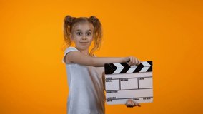 Funny girl clapping flapper pretending to be film producer, future career, dream