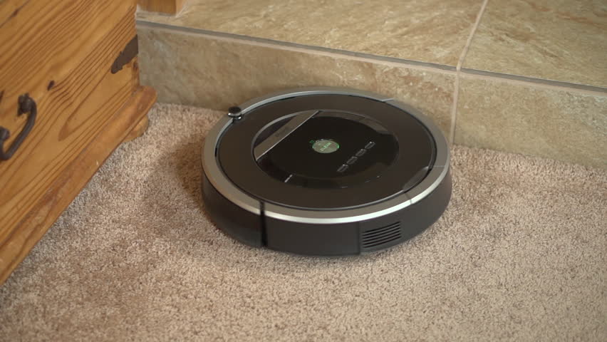 Starting the iRobot Roomba robotic vacuum cleaner and watching it detect and avoid furniture as it cleans. Taken in Vista, CA / USA, May 9, 2018. | Shutterstock HD Video #1027738727