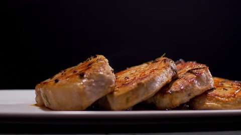 Tasty Pork Steaks. Pouring with Roasted Sauce