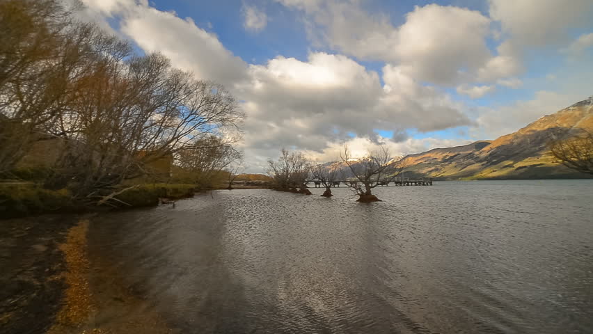 Camera Pan Right Motion. Beautiful Lakeside Scenery With Snow Peak Mountain Range At Glenorchy, New Zealand