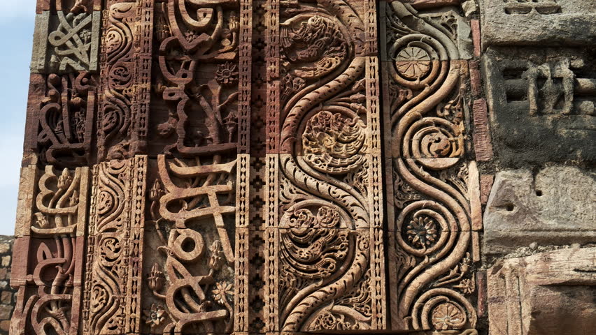DELHI, INDIA - MARCH 12, 2019: arabic carving at qutub minar complex ruins in delhi, india