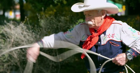 American cowboy throws a lasso rope
