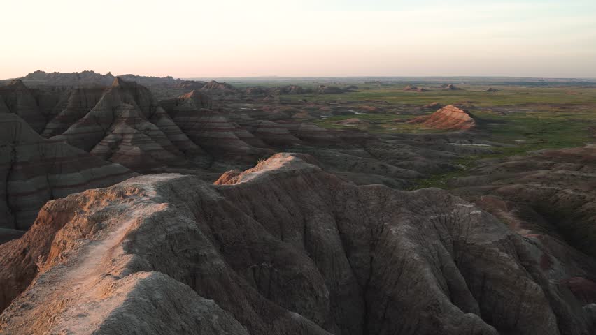 Person walking along the cliff trail at Badlands National Park, South Dakota
