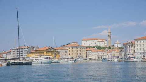 PIRAN, SLOVENIA - 7. AUGUST 2018 A sea town of Piran in its beauty. Summer time. Many boats and speedboats are anchored in the harbour.