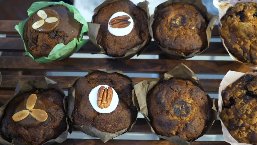 Freshly Baked Muffins On Display. Desserts In Bakery Shop Cafe.