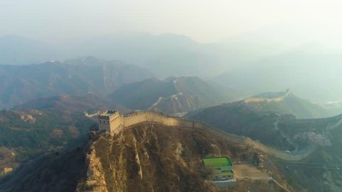 Great Wall of China and Green Mountains in Haze. Badaling. Aerial View. Drone Flies Sideways and Upwards