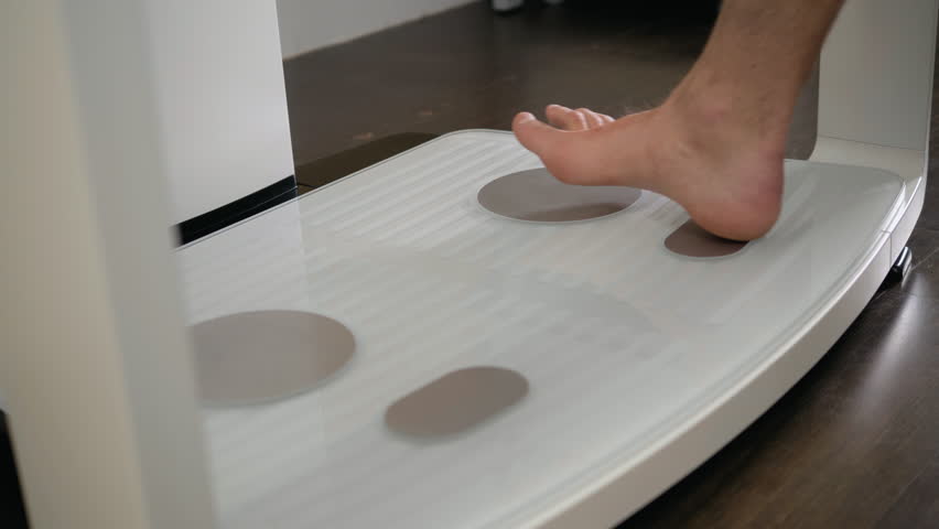 orthopedic physiotherapist check body growth of young athlete sport man body mass analysis