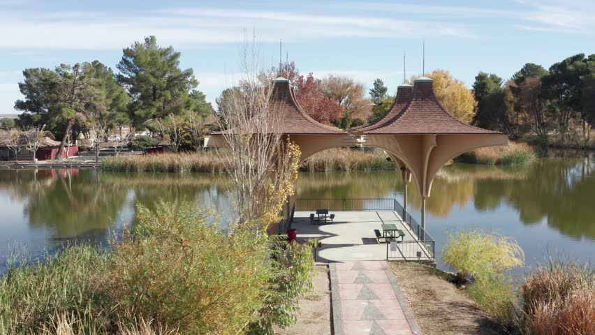 Aerial Circling Shot of lake pavilion in California City Central Park