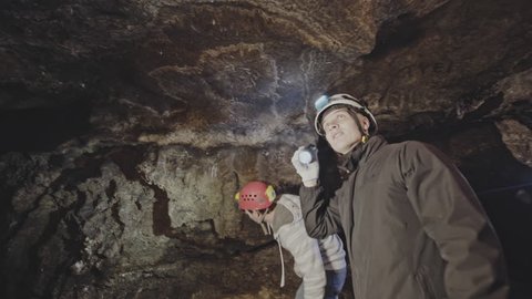 A team of young tourists traveling to explore the cave and the depths of the earth