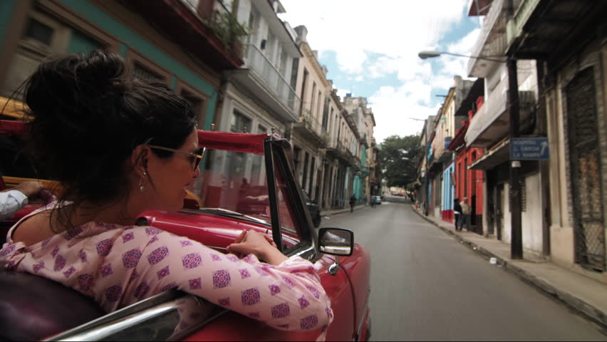 Woman Riding in Vintage Car in Havana Cuba
