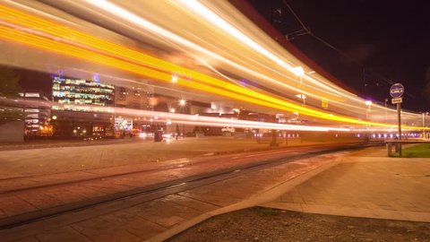 Timelapse of Salford Quays MediaCity Manchester city urban trams at night.