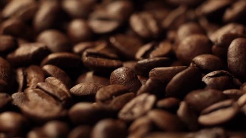 Coffee close up. Roasted coffee beans with. Coffee beans factory mixing.