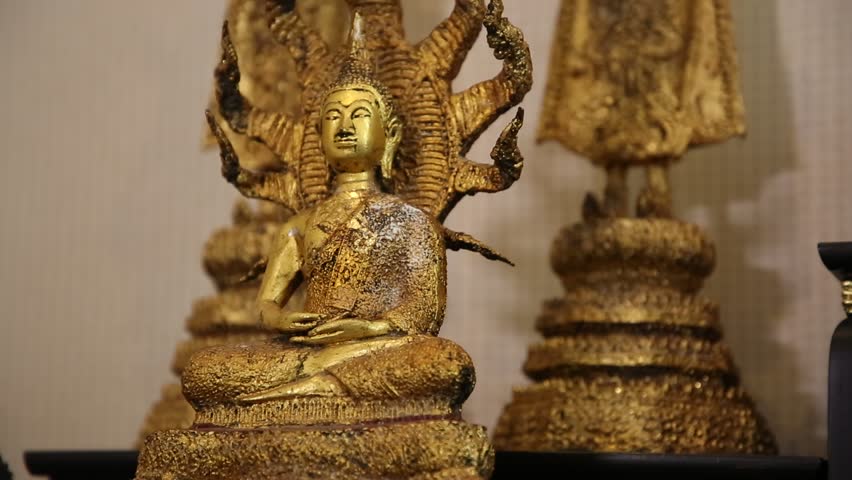 A close up shot of a beautiful old Buddha statue.