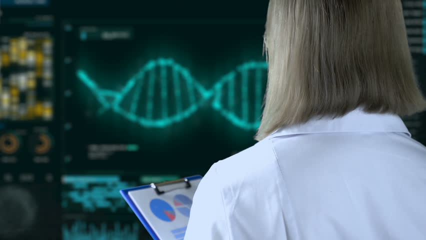 Scientist looks at mockup of DNA in lab Healthcare Videos | Creative Market