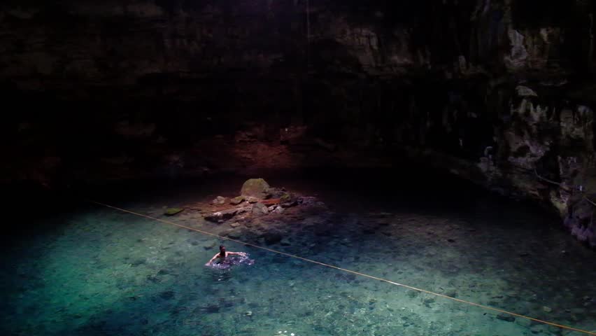 Cenote Samula sinkhole light beam near Valladolid in Yucatan Mexico 