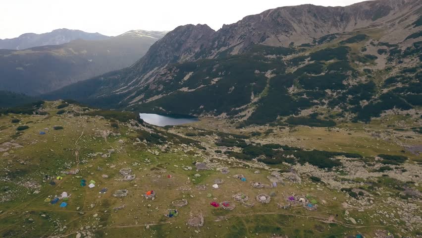 Flying over the top of tents as hikers prepare to summit Peleaga the next day.