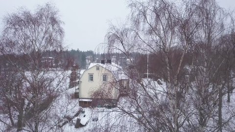 Ronninge, Sweden - 03 08 2018: Uttran Lake, Rönninge, Sweden - March 8th, 2018- Side view of pretty cottage in forest