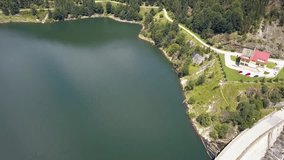 Tilting Aerial Drone Shot to a Complete Overhead Shot of a Man Made Dam.