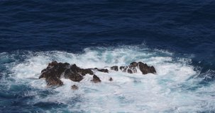 Wave crash into rock coastline, Atlantic Ocean, Porto Moniz, Madeira Island Portugal, Slow Motion 4K