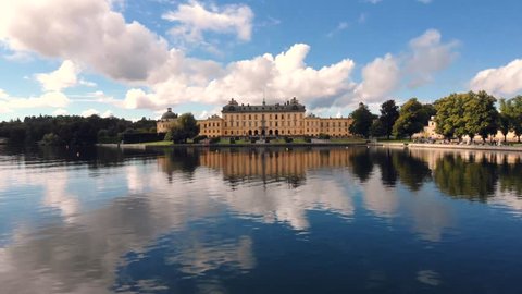 Drottningholm Palace, aerial drone flight above the lake water