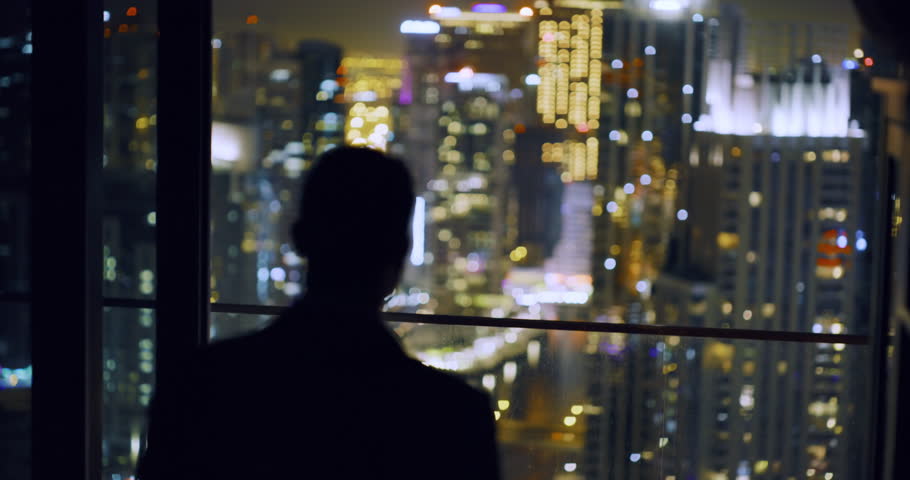 Successful Young Man Standing At Balcony City Skyline Dubai Urban Panorama Fame Night City Lights Slow Motion Red Epic 8k Royalty-Free Stock Footage #1027882874