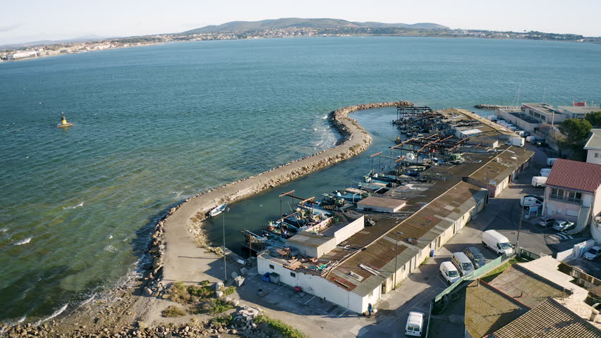 Aerial drone view of the Port du Barrou fishing harbor with Balaruc les Bains in background