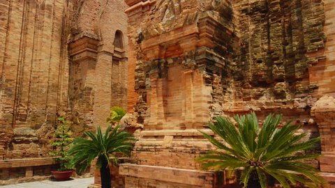 Gimbal forward stone Po Nagar Cham temple stately temple complex Vietnam Nha Trang ruin nobody. Religion buddhism authentic culture Asia. Landmark heritage architecture. Sunny day exotic palm. Travel