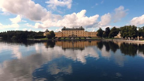 Drottningholm Palace, aerial drone flight above the lake water