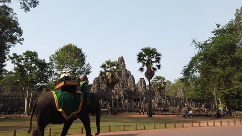 Siem reap, Cambodia-April 17, 2019: tourists riding elephants around the Bayon temple in Angkor, Siem reap, Cambodia.