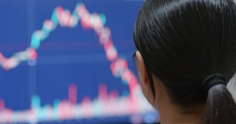 Woman study the stock market on computer