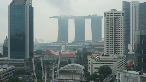 Time-lapse of fog gradually covering the skyline of downtown Singapore.