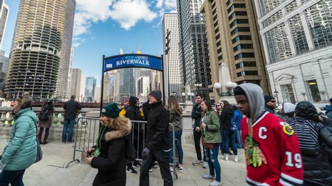 Chicago, Illinois, USA - March 16 2019 : Chicago Riverwalk with undefined various tourists in Downtown Chicago at Michigan avenue on March 16, 2019, United States.