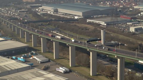 Aerial view of congested traffic leaving the QE2 Dartford crossing on the River Thames, Kent / Essex England.