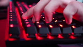 World Championship Cyber gaming. RGB neon light. Rivalry of a group of experienced players. Winner team, competitive. Professional esport gamers compete. Gamer playing a video game with keyboard. 