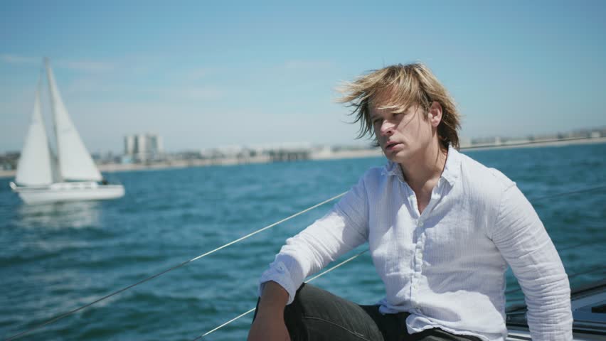 Sailor on yacht in Pacific Ocean 