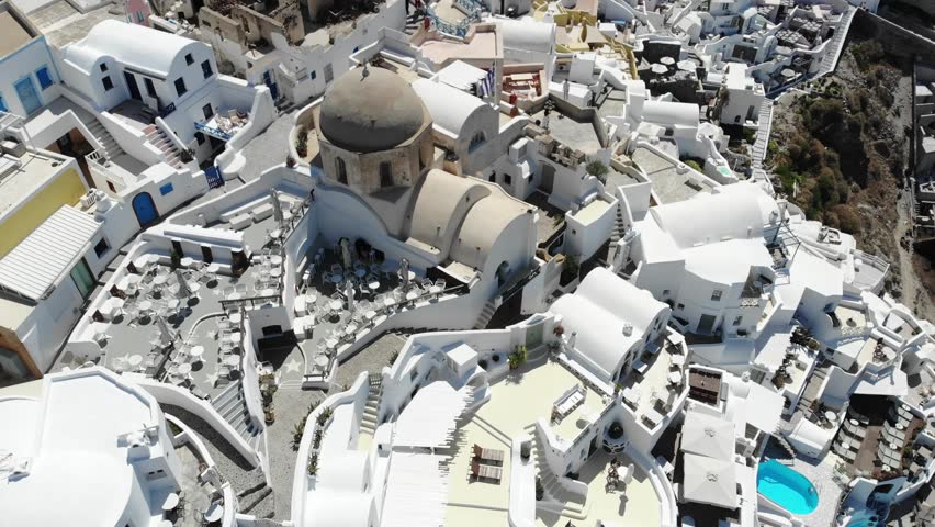 Cinematic aerial view of world famous Greek Island called Sanotrini