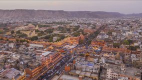 Hawa Mahal (Wind Palace) in Jaipur, India, hyperlapse, 4k aerial drone evening skyline and city traffic