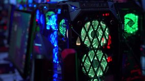 Cooler with neon lights. Computer gamer. World Computer Games Championship. Streaming. Mining virtual currency. Computer components. Render farm.