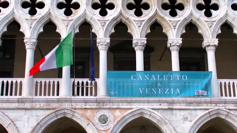 VENICE, ITALY, 17 MARCH 2019 : Doge's Palace-Palazzo Ducale detail with the Italian flag waving, Venice, Italy