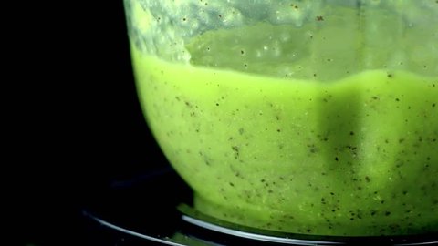 Fruit kiwi Blender Smoothie green colour macro view, cooking in slow motion