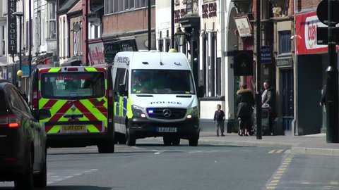 UK Police van driving down city Centre Street. Kingston upon Hull city centre 16/04/2019