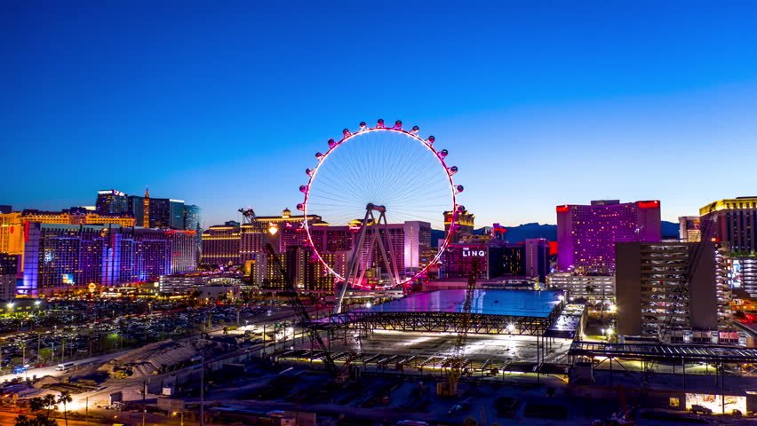 Las Vegas, Nevada/USA - March 30, 2019:  This aerial hyper lapse taken at dusk, just east of the Las Vegas Strip, shows the expansion of the Sands Convention Center backdropped by the High Roller.