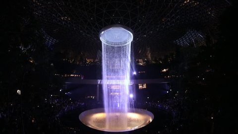 Singapore,Singapore - April 20, 2019 : Light show at vortex waterfall at Jewel Changi Aiport connecting to Terminal 1 Arrival and Terminal 2,3 through linked bridges