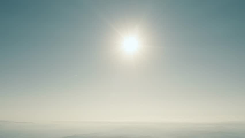 High altitude aerial view of the sun and clear blue sky