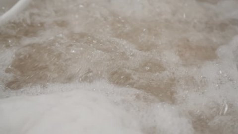 Close-up of bubbling water in the in hidromassage tub.